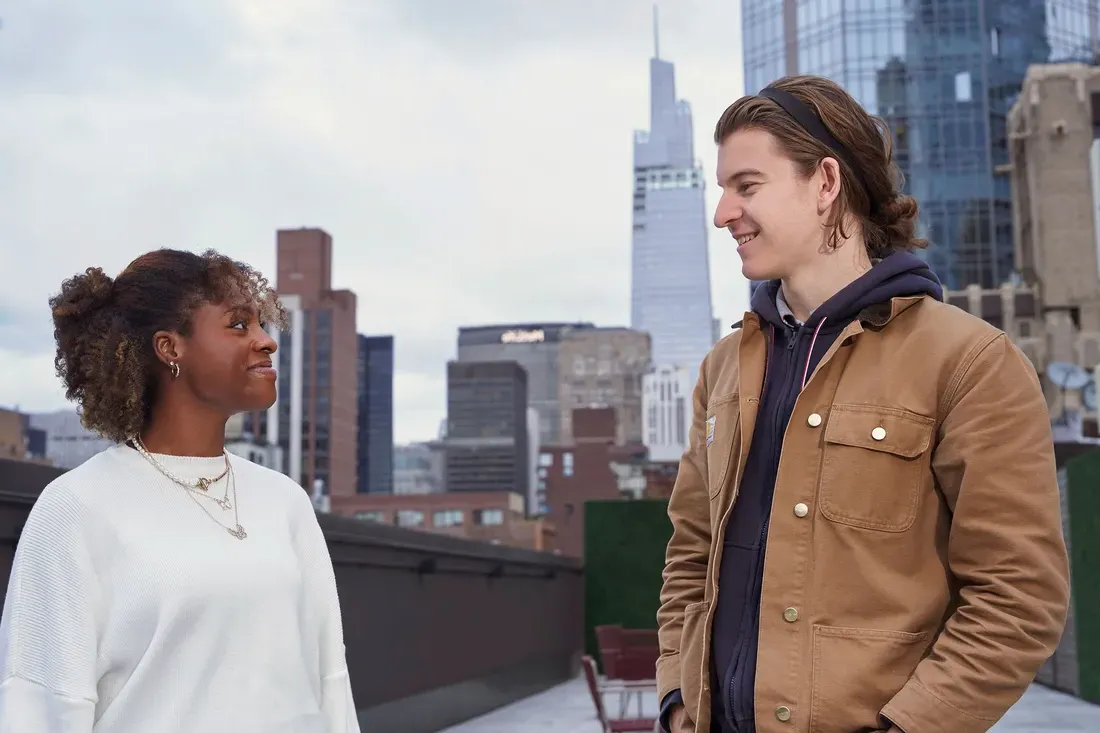 Two students talking in New York City.